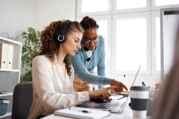 Female coworkers working together in small offfice Female coworkers working together in small offfice